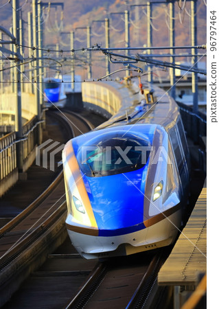 Hokuriku Shinkansen E7 series running through curves Hokuriku Shinkansen E7 series running through curves 96797464