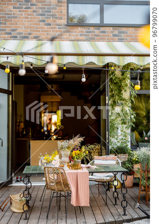 Dining place on terrace at backyard Dining place on terrace at backyard 96799070