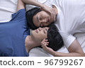 Asian gay couple relaxing and lying down in bed. 96799267