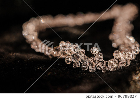 Necklace with stones on black background Necklace with stones on black background 96799827