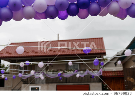 Wedding arch made of colorful balloons. Children's holiday celebration. balloon arch. purple balloons Wedding arch made of colorful balloons. Children's holiday celebration. balloon arch. purple balloons 96799923