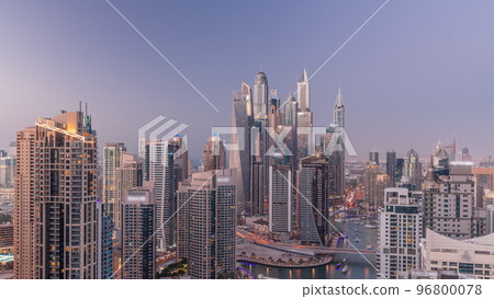 View of various skyscrapers in tallest recidential block in Dubai Marina aerial day to night timelapse View of various skyscrapers in tallest recidential block in Dubai Marina aerial day to night timelapse 96800078