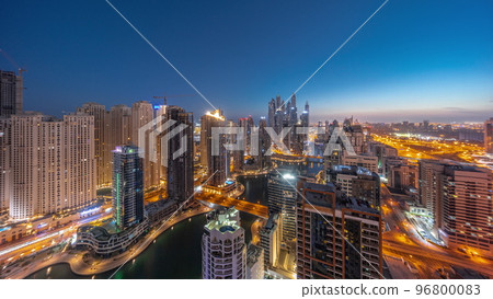 Panorama of various skyscrapers in tallest recidential block in Dubai Marina aerial night to day timelapse Panorama of various skyscrapers in tallest recidential block in Dubai Marina aerial night to day timelapse 96800083