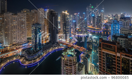 Panorama showing various skyscrapers in tallest recidential block in Dubai Marina aerial night timelapse 96800085