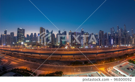 Panorama of Dubai Marina skyscrapers and Sheikh Zayed road with metro railway aerial day to night timelapse, United Arab Emirates 96800092