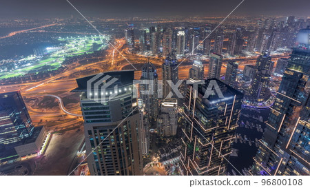 Panorama of Dubai Marina with JLT skyscrapers and golf course night timelapse, Dubai, United Arab Emirates. Panorama of Dubai Marina with JLT skyscrapers and golf course night timelapse, Dubai, United Arab Emirates. 96800108