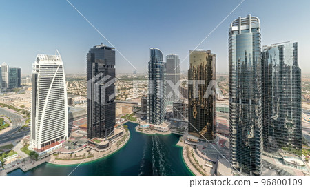 Panorama showing tall residential buildings at JLT aerial timelapse, part of the Dubai multi commodities centre mixed-use district. Panorama showing tall residential buildings at JLT aerial timelapse, part of the Dubai multi commodities centre mixed-use district. 96800109