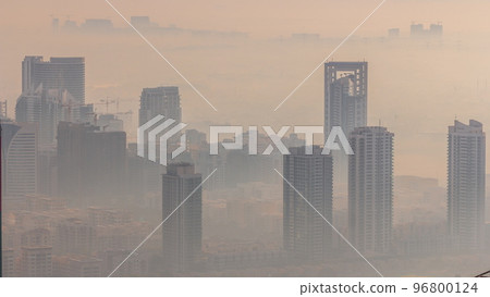 Dubai Aerial view showing fog over al barsha heights and greens district area timelapse 96800124
