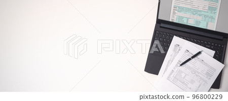 US tax form on computer keyboard US tax form on computer keyboard 96800229