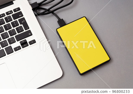 External hard disk connected to laptop. 96800233