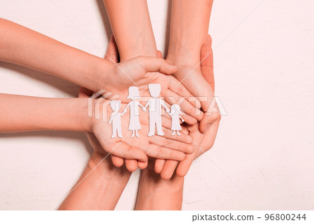 Hands with paper family silhouette. Family care Hands with paper family silhouette. Family care 96800244
