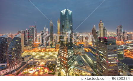 Panorama of futuristic skyscrapers in financial district business center in Dubai night to day timelapse 96800284