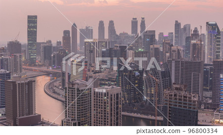 Skyline with modern architecture of Dubai business bay towers day to night timelapse. Aerial view Skyline with modern architecture of Dubai business bay towers day to night timelapse. Aerial view 96800334