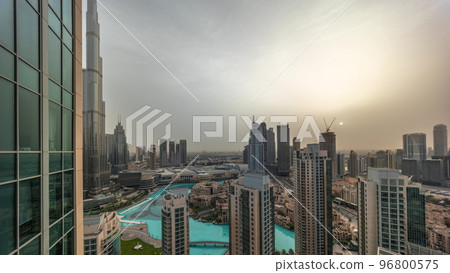 Dubai downtown during sunrise with fountains and modern futuristic architecture aerial timelapse 96800575