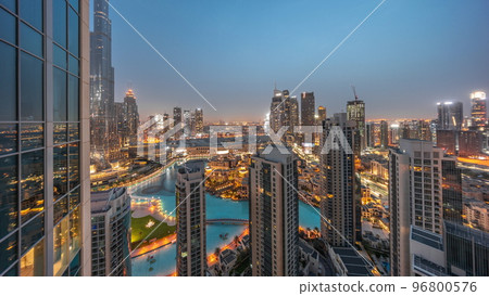 Dubai downtown with fountains and modern futuristic architecture aerial night to day timelapse 96800576