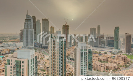Aerial panoramic sunrise over big futuristic city timelapse. Business bay and Downtown 96800577