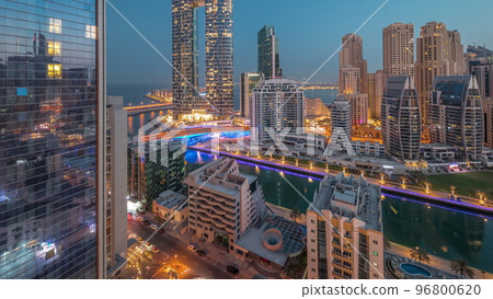 Dubai Marina skyscrapers and JBR district with luxury buildings and resorts aerial night to day timelapse Dubai Marina skyscrapers and JBR district with luxury buildings and resorts aerial night to day timelapse 96800620
