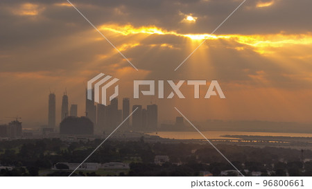 Sunrise over Dubai Creek Harbor with skyscrapers and towers under construction aerial timelapse Sunrise over Dubai Creek Harbor with skyscrapers and towers under construction aerial timelapse 96800661