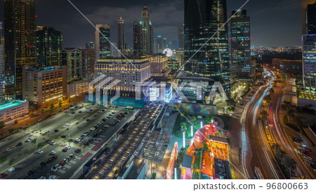 Panorama showing Dubai International Financial district aerial night timelapse. View of business and financial office towers. Panorama showing Dubai International Financial district aerial night timelapse. View of business and financial office towers. 96800663