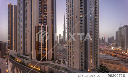 Tallest skyscrapers in downtown dubai located on bouleward street near shopping mall aerial day to night timelapse. 96800728