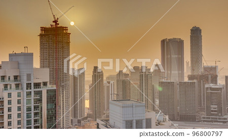 Aerial sunrise over big futuristic city timelapse. Business bay and Downtown Aerial sunrise over big futuristic city timelapse. Business bay and Downtown 96800797