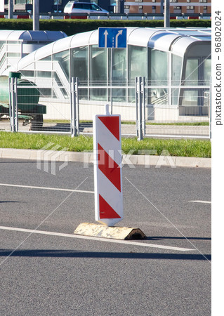 Striped road signs in middle of road Striped road signs in middle of road 96802024