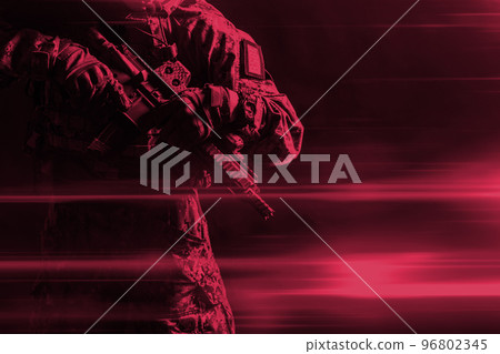 Special forces soldier with rifle on dark background. Color of the year 2023, viva magenta. 96802345