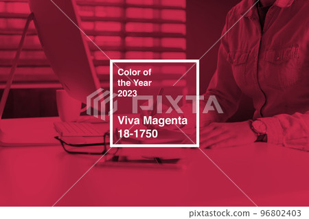 businesswoman working at her office. Color of the year 2023, viva magenta. businesswoman working at her office. Color of the year 2023, viva magenta. 96802403