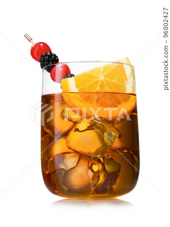 Large luxury glass of old fashioned cocktail with orange slice,cherry and blackberry Large luxury glass of old fashioned cocktail with orange slice,cherry and blackberry 96802427