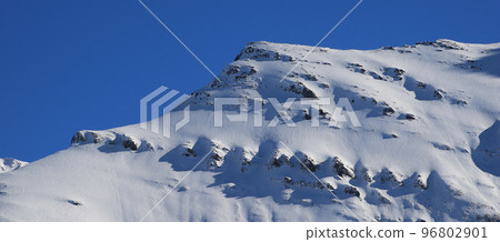 Rock structures on snow covered Mount Mittaghorn, Elm. 96802901