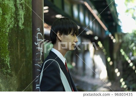 A high school boy with a dark expression 96803435