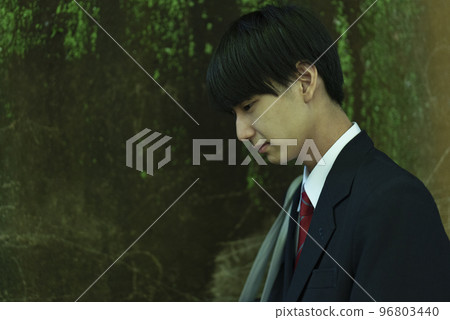 A high school boy with a dark expression 96803440