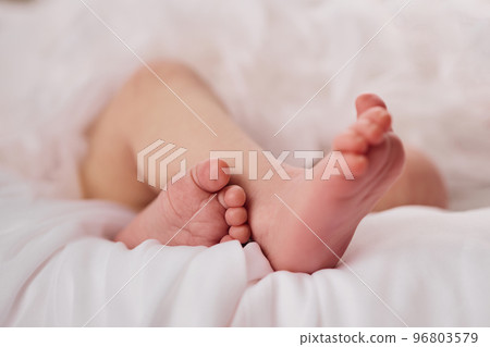 Newborn baby feet on light background 96803579