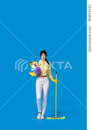 woman in rubber gloves with cleaning supplies 96803585