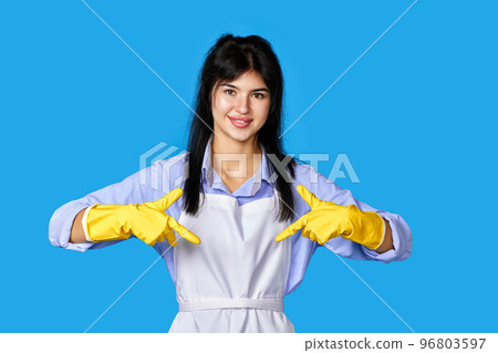 woman in rubber gloves pointing oneself with fingers woman in rubber gloves pointing oneself with fingers 96803597