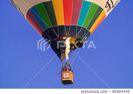 Hot air balloon flying in clear sky 96804440