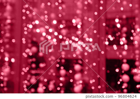 Blurred viva magenta garland. City night light blur bokeh, defocused abstract background. Blurred viva magenta garland. City night light blur bokeh, defocused abstract background. 96804624