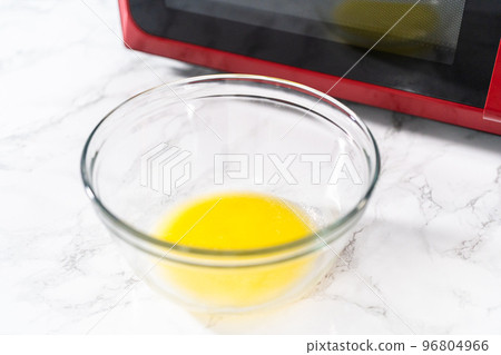 Melting stick of unsalted butter in a microwave. 96804966