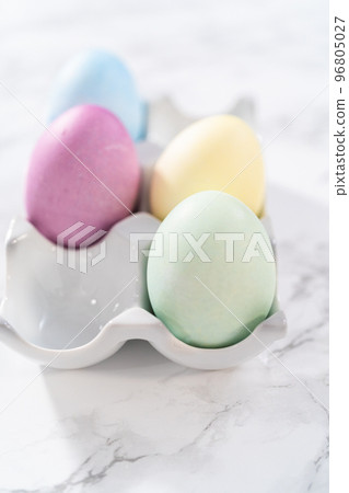 Colored hard-boiled eggs on a marble background. 96805027