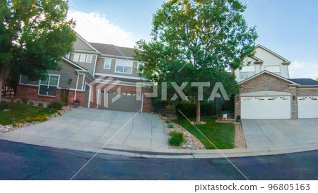 View of the typical suburban neighborhood on a summer morning. 96805163