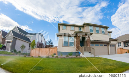View of the typical suburban neighborhood on a summer morning. 96805233