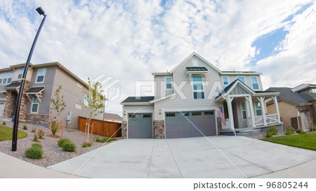 View of the typical suburban neighborhood on a summer morning. 96805244