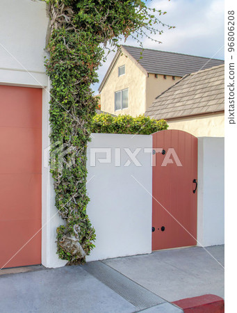 Vertical Garage and gate with coral pink palette at La Jolla, California 96806208