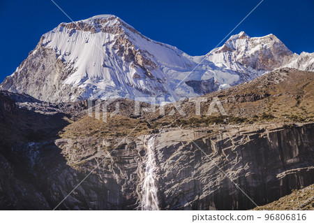 Waterfall and Huascaran massif in Cordillera Blanca, snowcapped Andes, Ancash, Peru 96806816