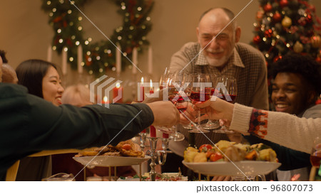 Family raising wineglasses celebrating Christmas 96807073