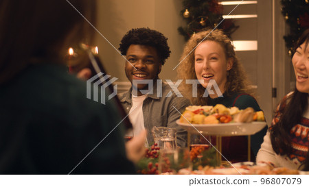 Family talking and eating on Christmas dinner Family talking and eating on Christmas dinner 96807079