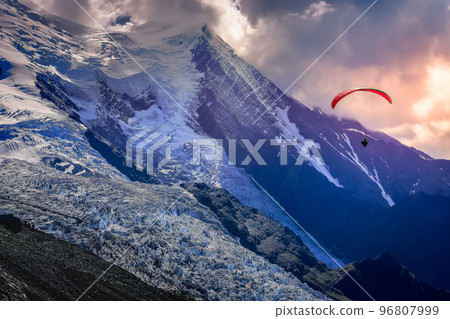 Paragliding above Mont Blanc massif alpine landscape , Chamonix, French Alps Paragliding above Mont Blanc massif alpine landscape , Chamonix, French Alps 96807999