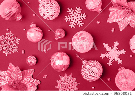 Trendy color of the year 2023.Holiday pattern made shiny christmas decorations toned in viva magenta color 96808081