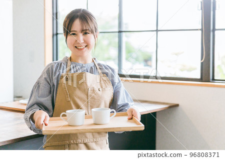 Hall staff/waitress asian woman carrying coffee in cafe/kitchen 96808371
