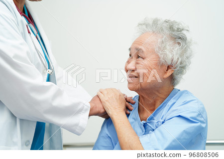 Doctor holding hands Asian elderly woman patient, help and care in hospital. Doctor holding hands Asian elderly woman patient, help and care in hospital. 96808506